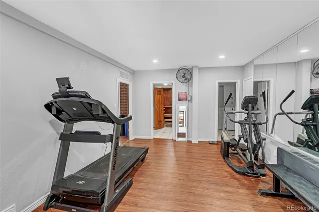 a living room with furniture a lamp and a large window
