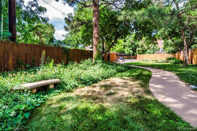 a view of a backyard with sitting area
