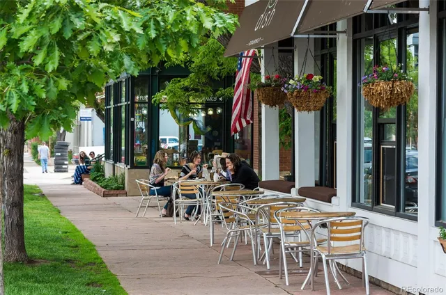 a view of a cafe with sitting area