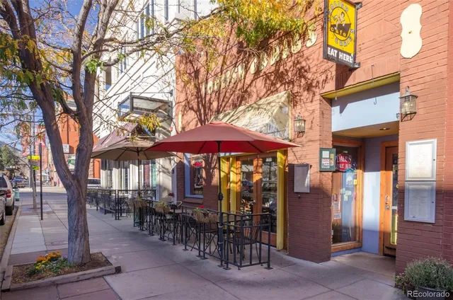 a view of a street with cars on the road