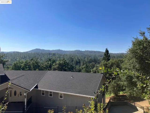 an aerial view of residential house with an outdoor space