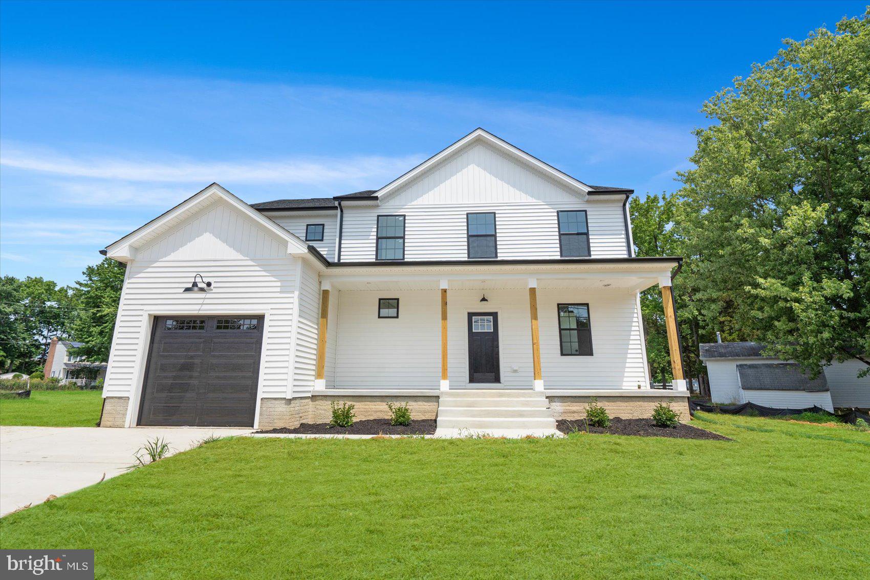 13101 Choptank Avenue Middle River, MD 21220 - Photo 1 of 27 a front view of a house with a yard