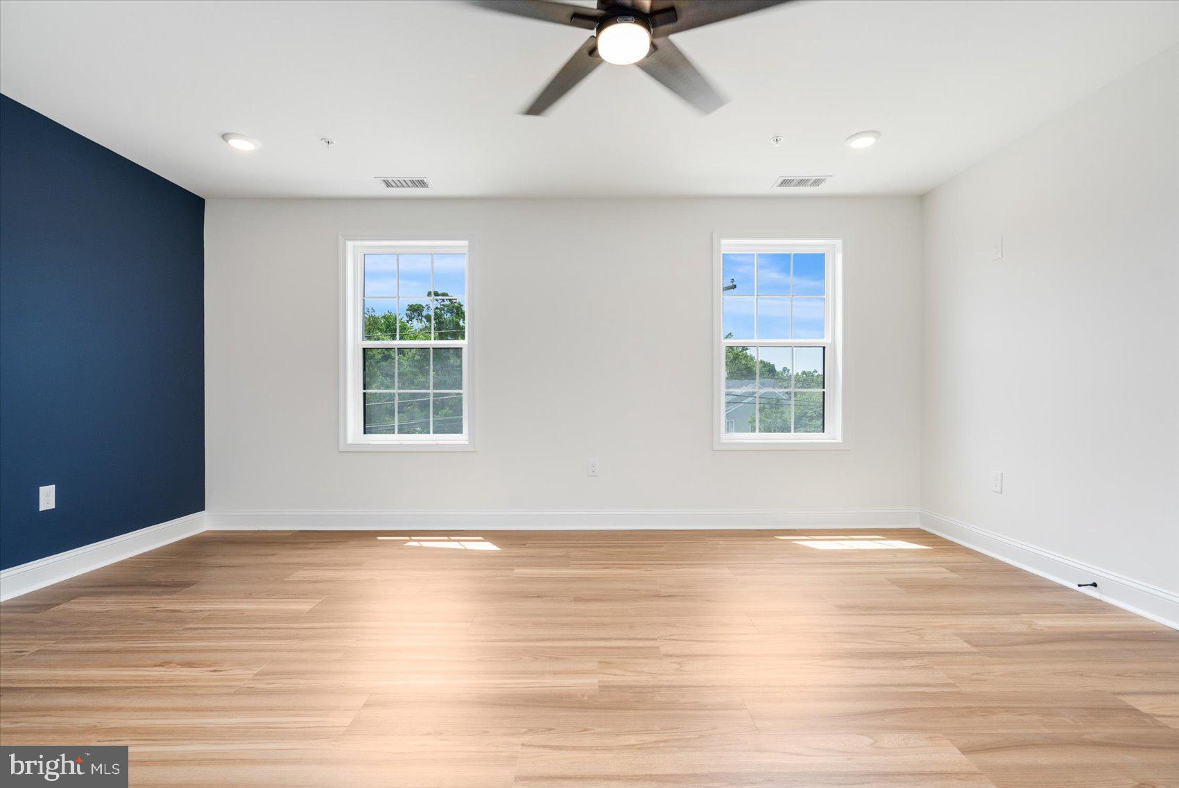 13101 Choptank Avenue Middle River, MD 21220 - Photo 14 of 27 a view of an empty room with wooden floor and a window