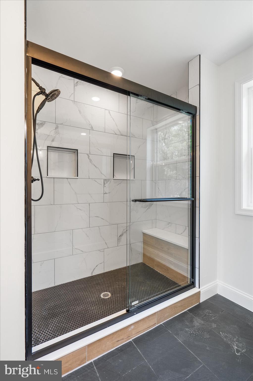 13101 Choptank Avenue Middle River, MD 21220 - Photo 15 of 27 a bathroom with a glass shower door