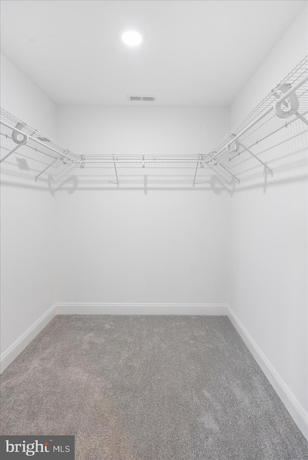 13101 Choptank Avenue Middle River, MD 21220 - Photo 17 of 27 a view of a room with racks on the wall