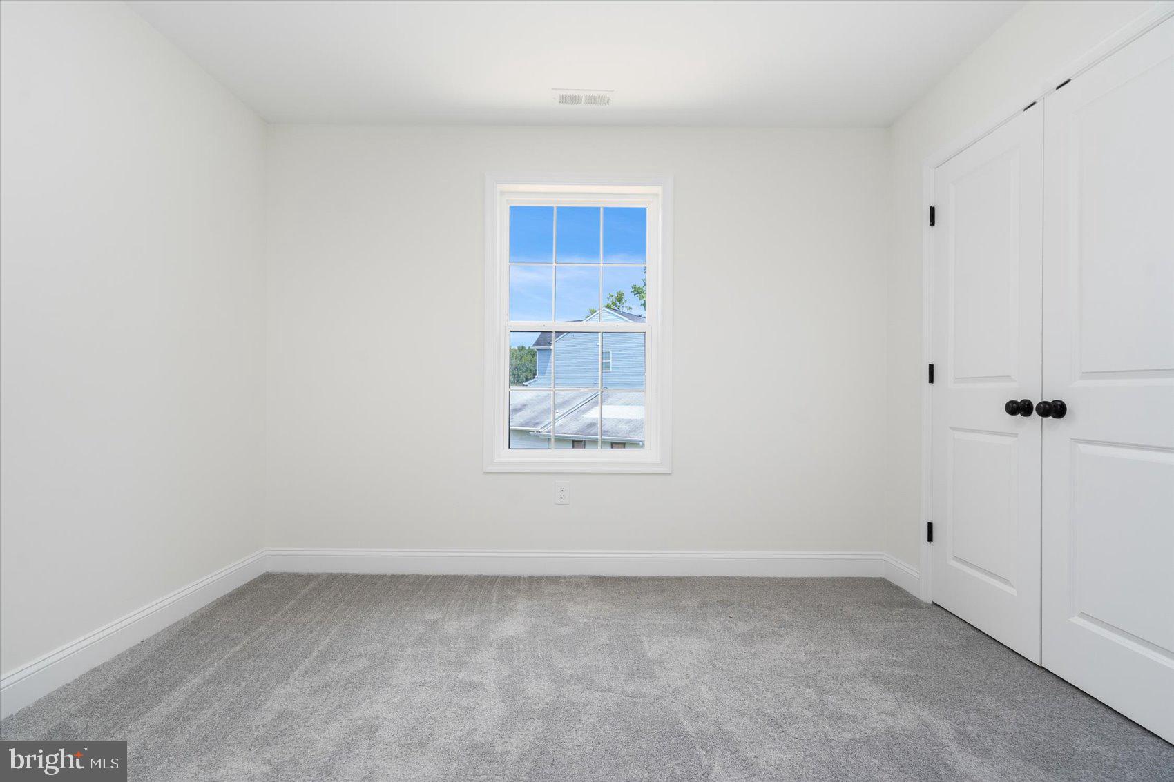 13101 Choptank Avenue Middle River, MD 21220 - Photo 25 of 27 an empty room with a window