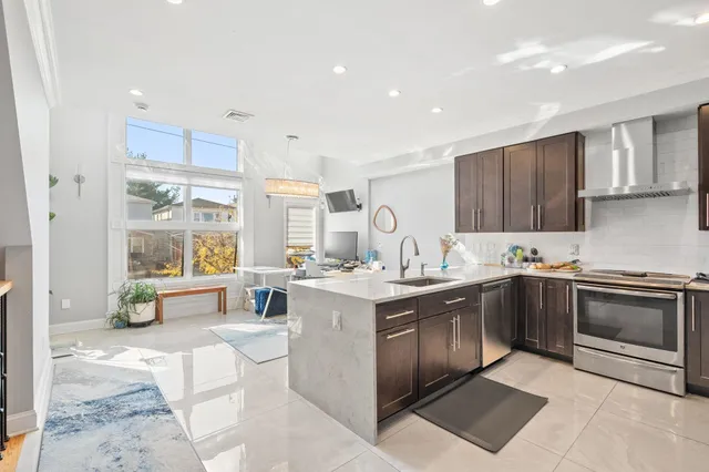 a kitchen with a sink stove and cabinets
