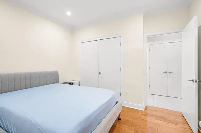 a bedroom with a bed and a rug