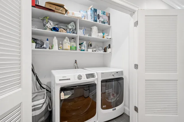 a utility room with dryer and washer