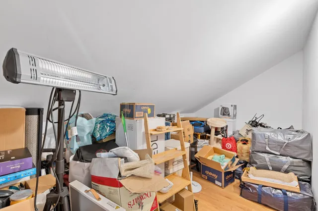 a view of a lake with couches chairs and city view