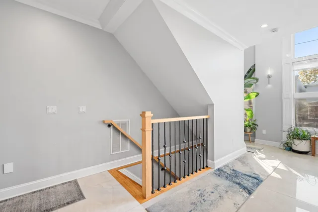 a view of an entryway with wooden floor