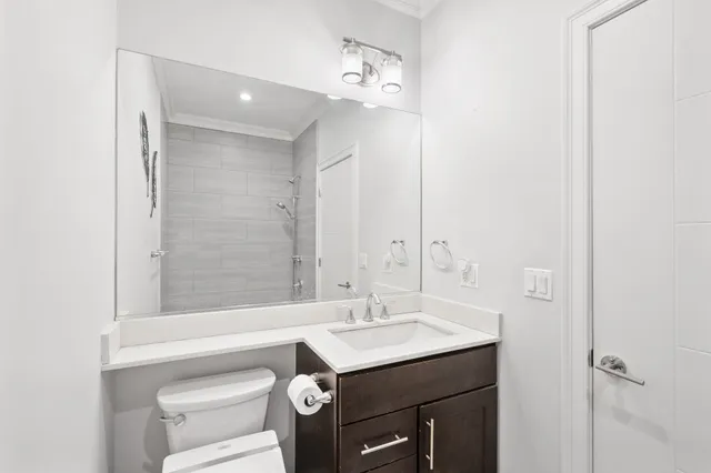 a bathroom with a sink vanity and a mirror