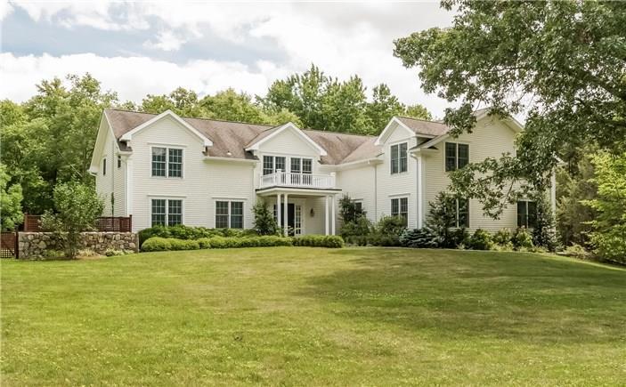 134 Remington Road Ridgefield, CT 06877 - Photo 1 of 1 a front view of a house with a garden