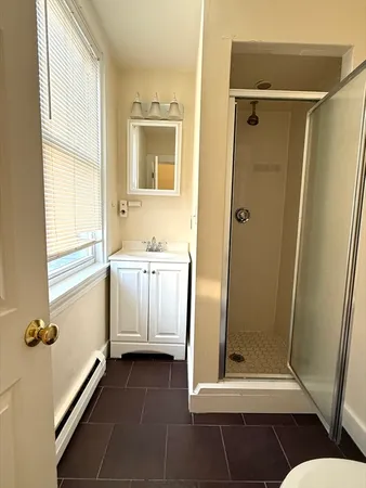 a bathroom with a tub and a shower