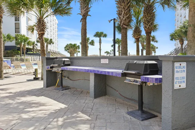 a table and chairs in front of a building
