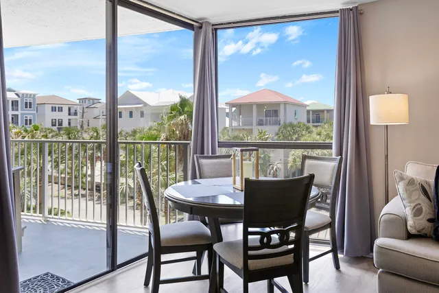 a view of a dining room with furniture window and outside view