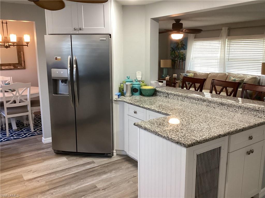4 Chateau Way Naples, FL 34112 - Photo 13 of 45 a kitchen with stainless steel appliances granite countertop a refrigerator a sink and a cabinets