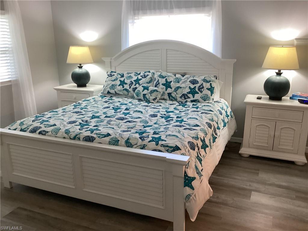 4 Chateau Way Naples, FL 34112 - Photo 17 of 45 a bedroom with a bed and window