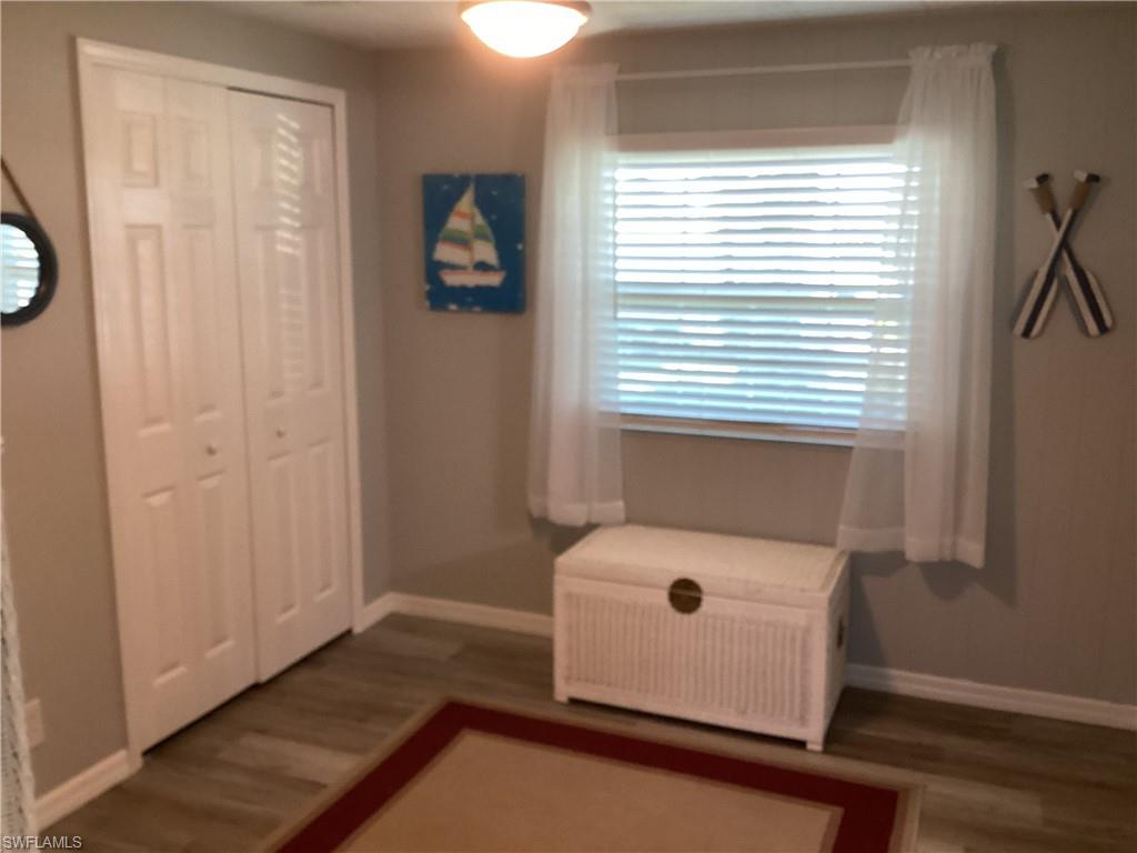 4 Chateau Way Naples, FL 34112 - Photo 21 of 45 a room with a window and a bed