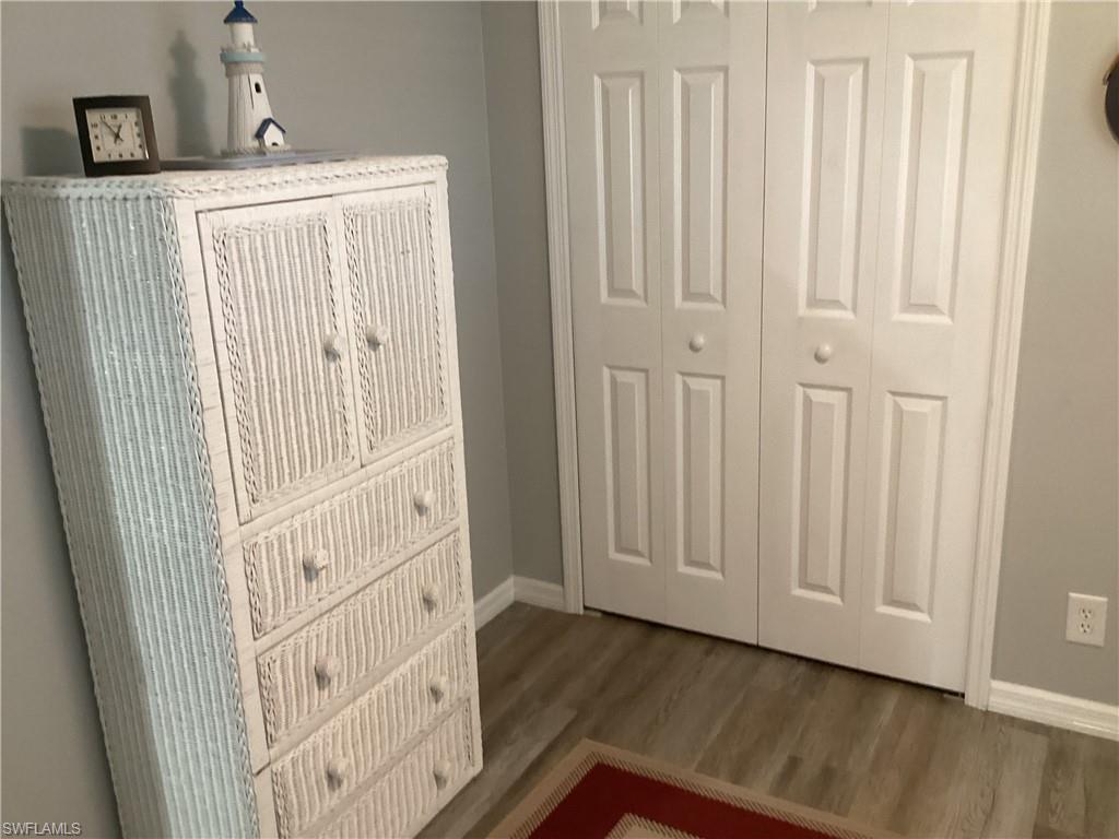 4 Chateau Way Naples, FL 34112 - Photo 22 of 45 an entryway with wooden floor