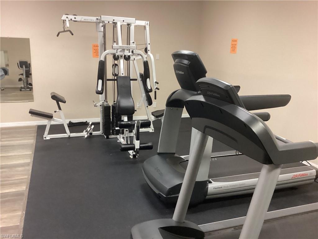 4 Chateau Way Naples, FL 34112 - Photo 38 of 45 a view of gym equipment with windows