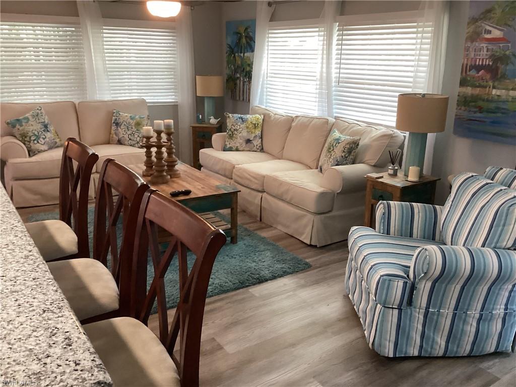 4 Chateau Way Naples, FL 34112 - Photo 7 of 45 a living room with furniture and a large window