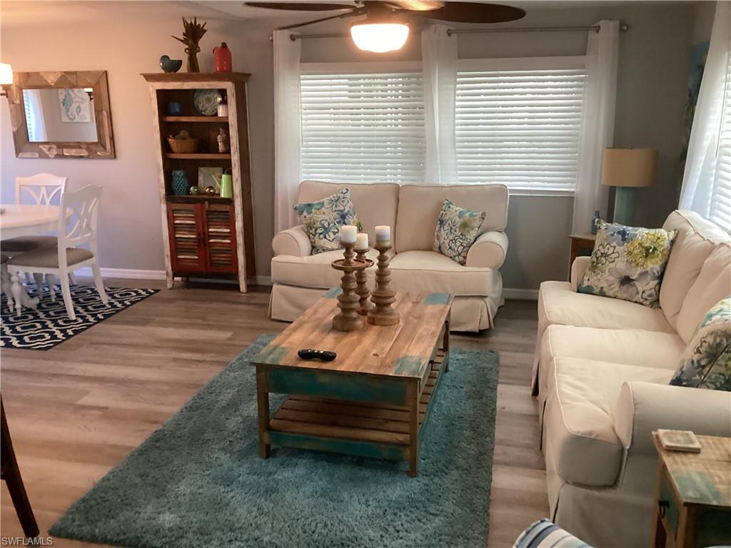 4 Chateau Way Naples, FL 34112 - Photo 8 of 45 a living room with furniture and a window