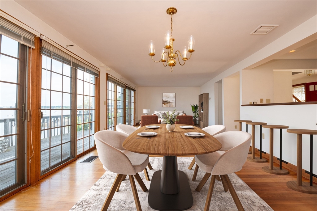 97 Pitman Road Marblehead, MA 01945 - Photo 12 of 37 a view of a dining room with furniture window and wooden floor