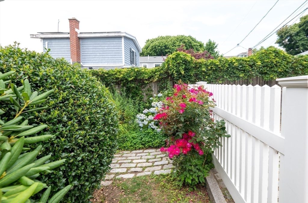 97 Pitman Road Marblehead, MA 01945 - Photo 18 of 37 a view of a house with a flower garden