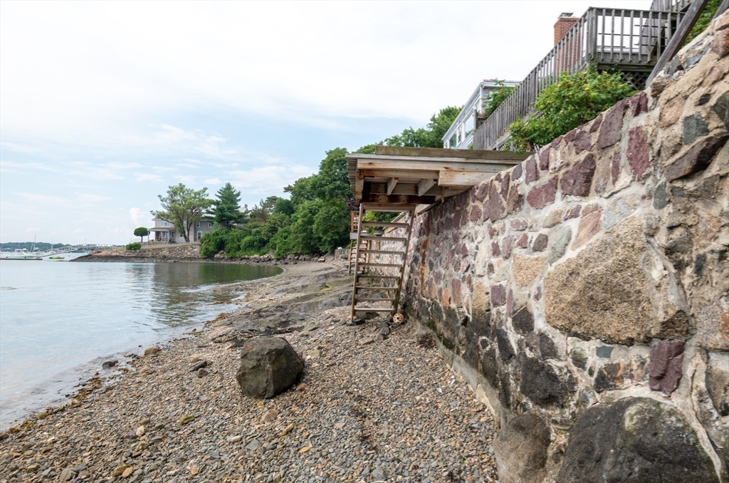 97 Pitman Road Marblehead, MA 01945 - Photo 23 of 37 a view of a lake with a house in the background