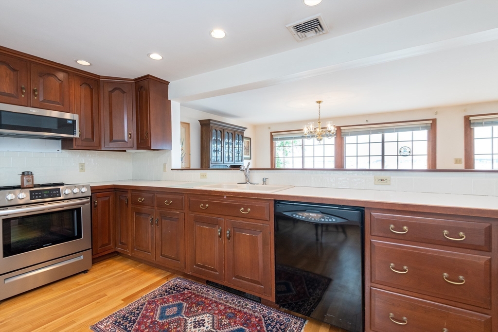 97 Pitman Road Marblehead, MA 01945 - Photo 28 of 37 a kitchen with granite countertop a sink cabinets and stainless steel appliances