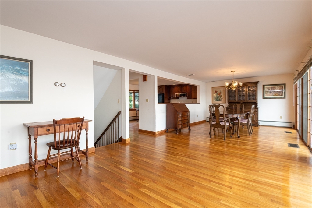 97 Pitman Road Marblehead, MA 01945 - Photo 29 of 37 a living room with furniture and a table with wooden floor