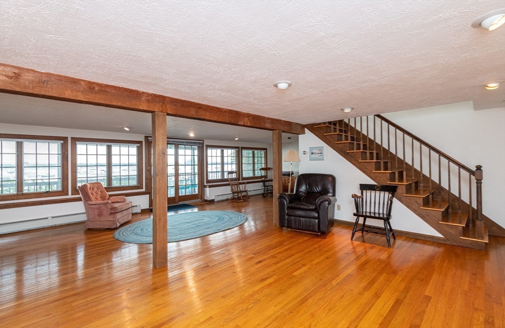 97 Pitman Road Marblehead, MA 01945 - Photo 30 of 37 a living room with furniture and a large window