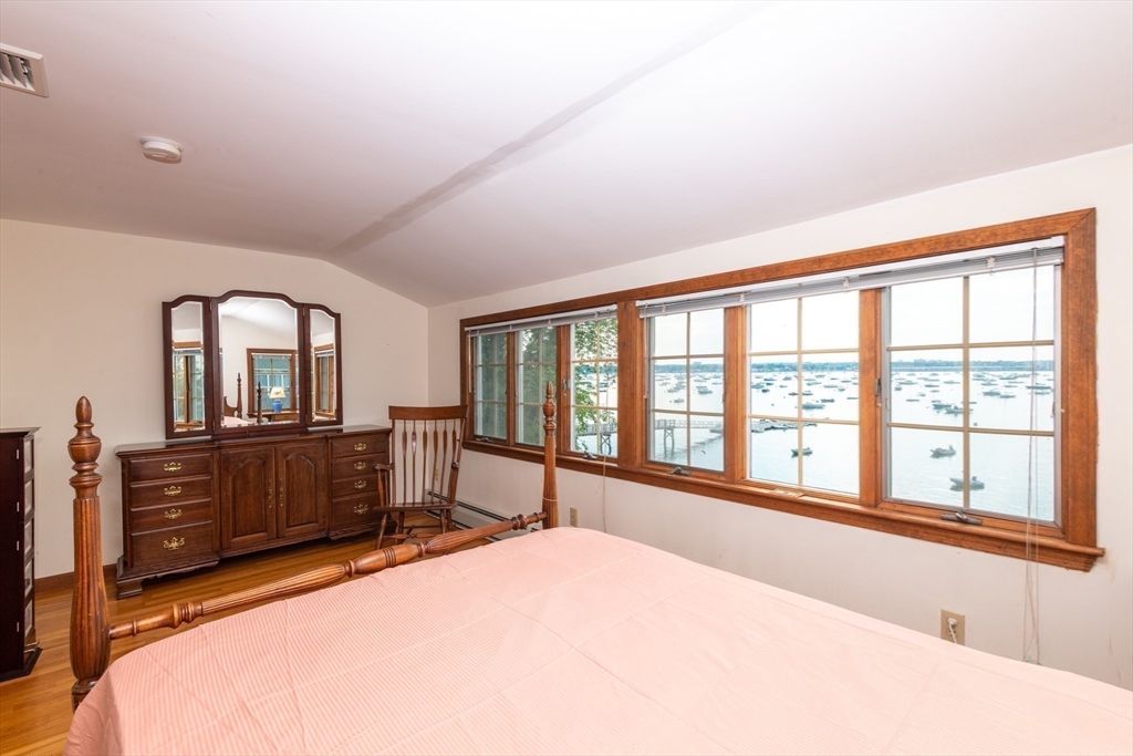 97 Pitman Road Marblehead, MA 01945 - Photo 33 of 37 a bedroom with a large bed and large windows