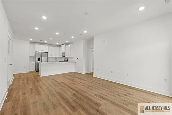 a view of kitchen with wooden floor
