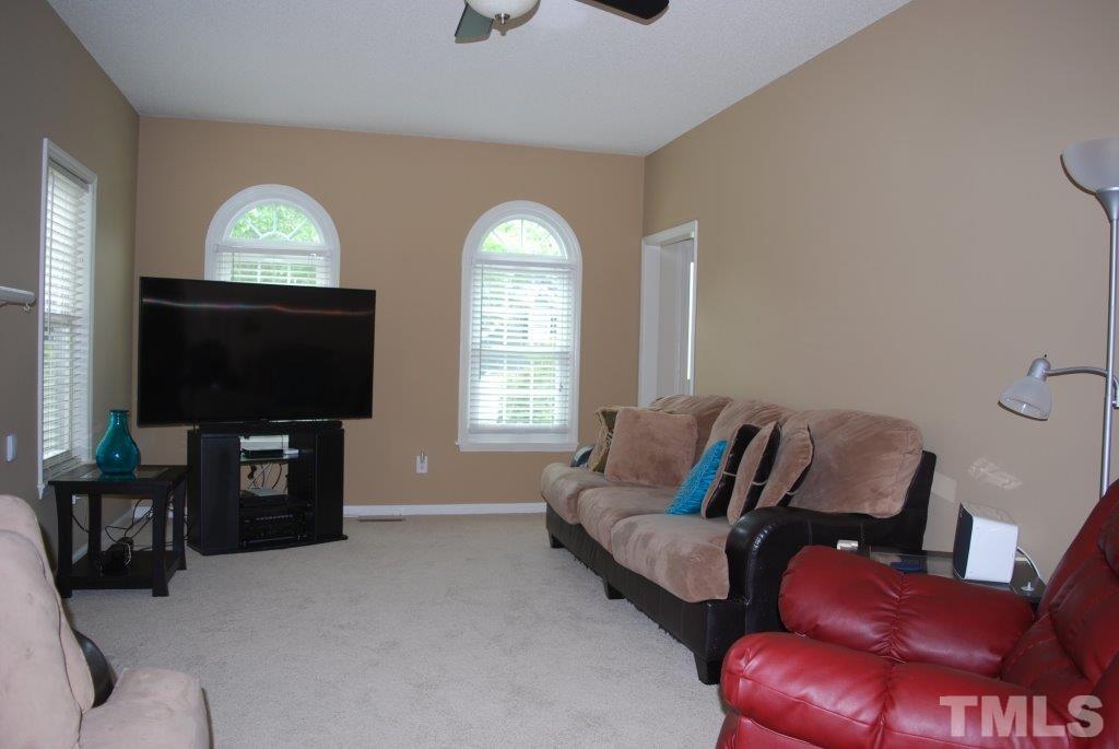 6808 Coventry Ridge Road Raleigh, NC 27616 - Photo 3 of 24 Large family room with gas logs