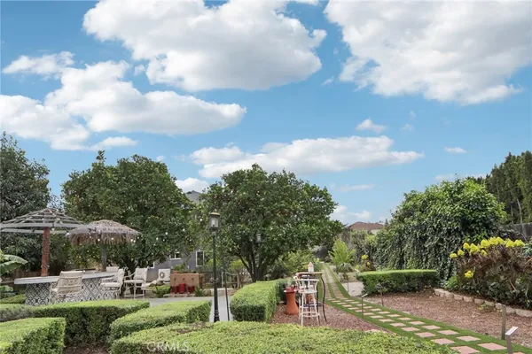 a front view of house with yard and outdoor seating