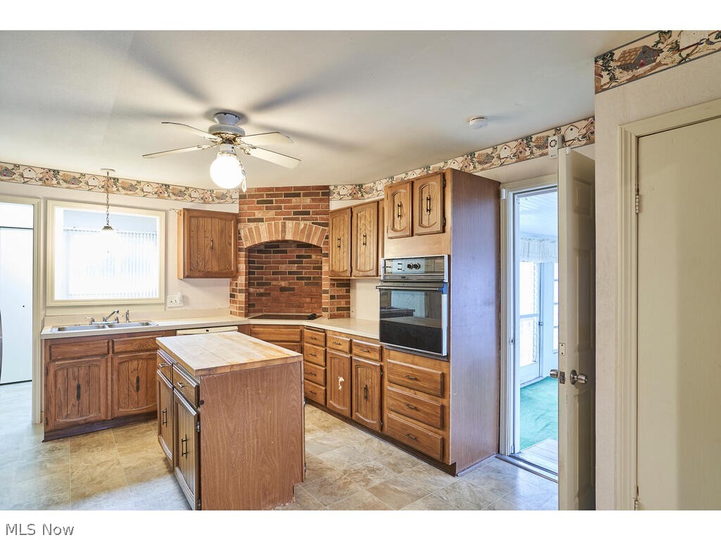 2963 Ridgewood Road Fairlawn, OH 44333 - Photo 9 of 30 Kitchen with island and vinyl flooring