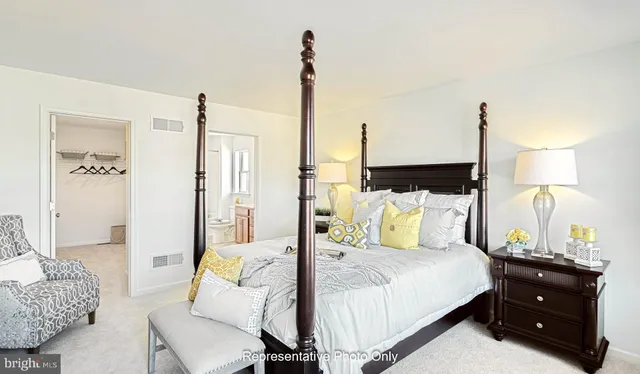 a bed room with a bed and a night stand