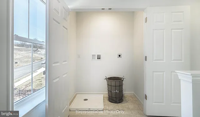 a picture of a bathroom with a sink and a window