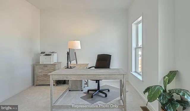 a view of a workspace with furniture