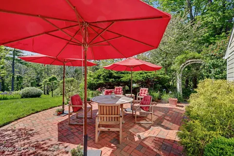 an outdoor space with furniture and umbrella