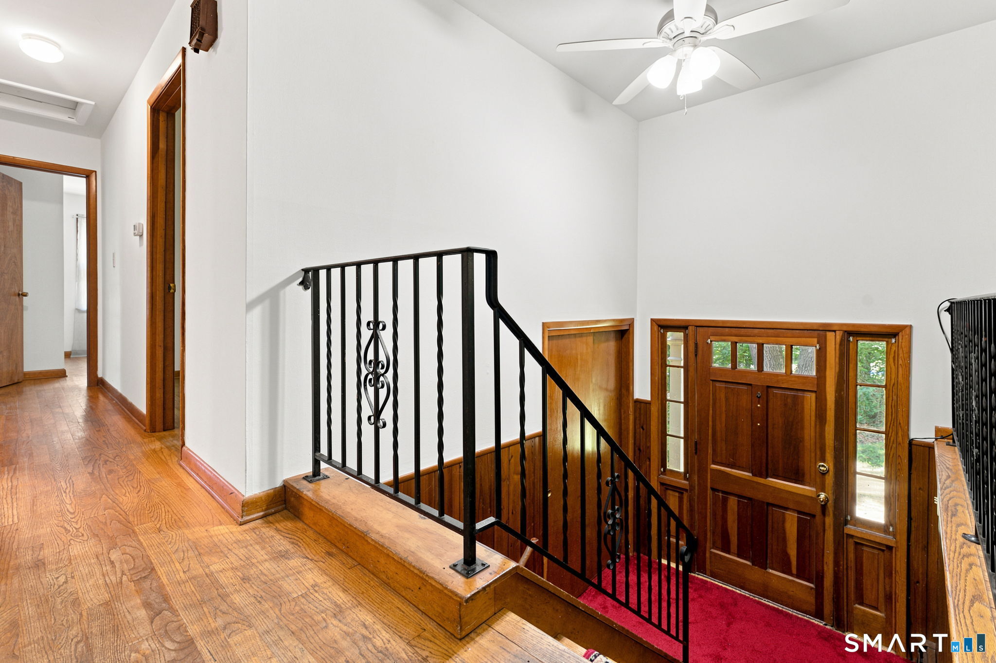 448 Mixville Road Cheshire, CT 06410 - Photo 2 of 32 a view of a hallway with wooden floor and staircase