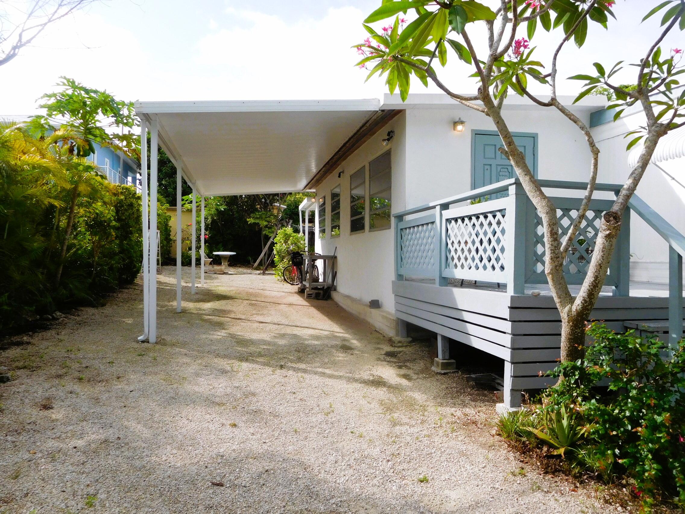 907 Plantation Road Key Largo, FL 33037 - Photo 1 of 39 outside front carport