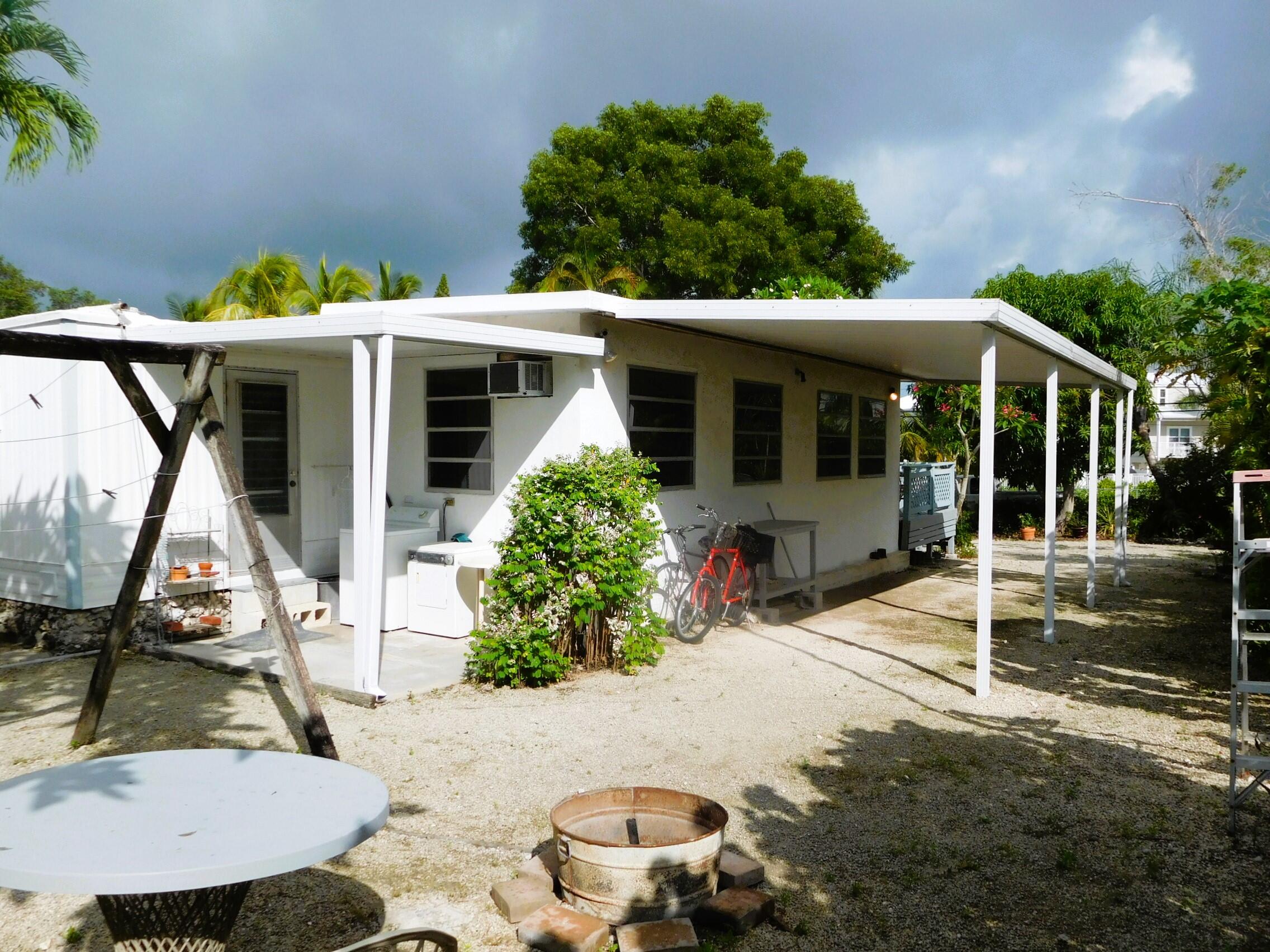 907 Plantation Road Key Largo, FL 33037 - Photo 3 of 39 outside back left carport