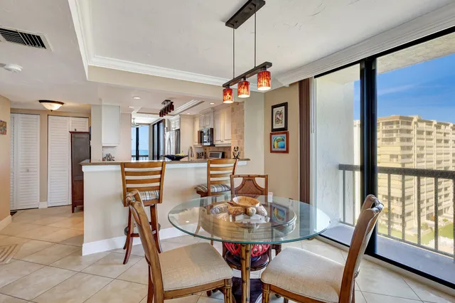 a view of a dining room with furniture window and outside view