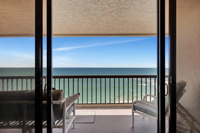 a view of balcony with wooden floor