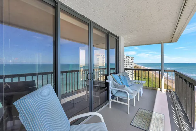 a balcony with chairs