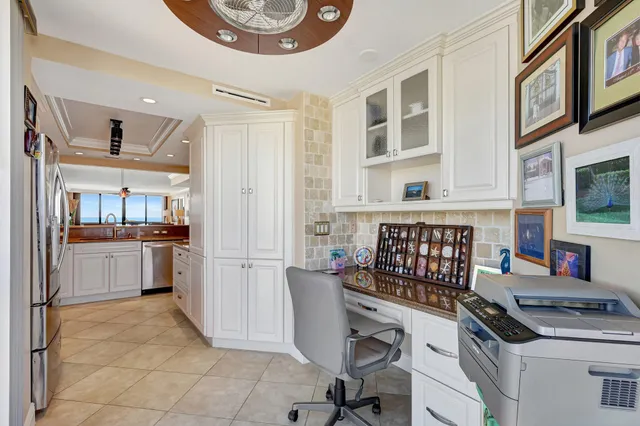 a kitchen with a stove a refrigerator and a cabinets