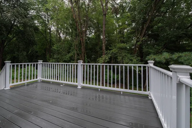 a view of deck and a yard